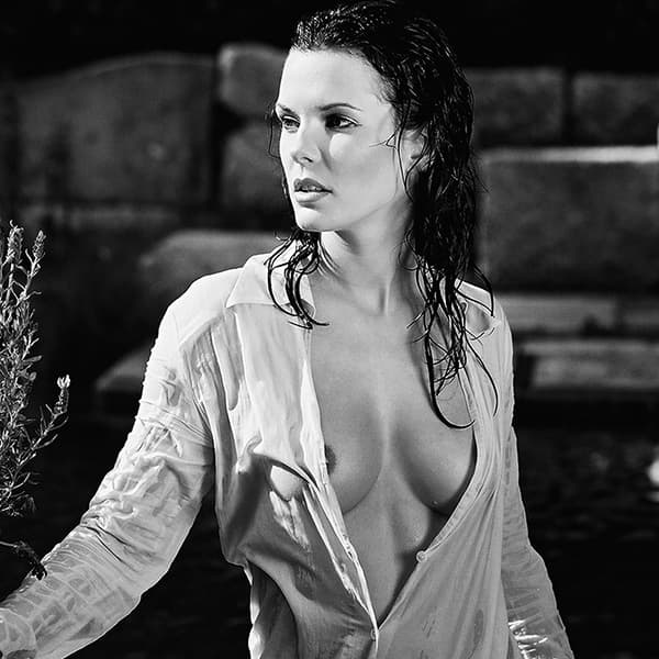Limited fine art nude photography of a woman in water with white fabric, clear waterline and minimal composition.